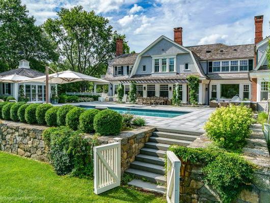 Custom pool, pool garden and pool house constructed by Onyx Corporation